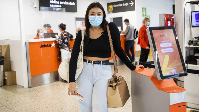 Catherine Martin arrives at Melbourne Airport only to quickly buy an expensive ticket to Sydney to avoid the looming five-day lockdown. Picture: Aaron Francis