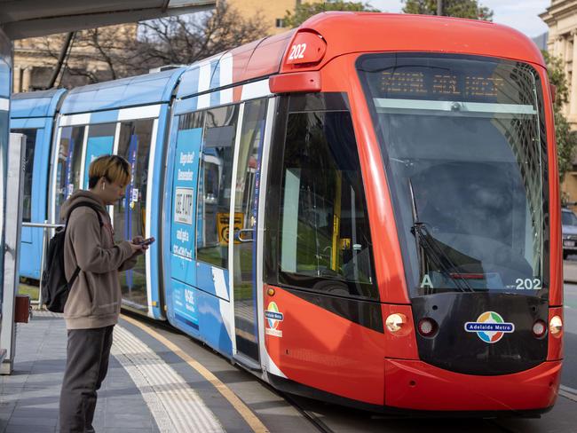 ADELAIDE, AUSTRALIA - NewsWire Photos 25, August, 2023: Commuters at the Victoria Square tram stop are warned to expect delays on Friday as tram drivers strike from 11am to 2pm, bringing services to a halt.   Picture: NCA NewsWire / Kelly Barnes