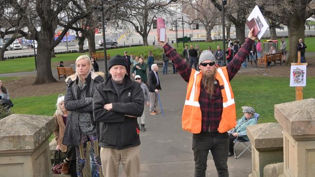 Anti-vaxxers and conspiracy theorists protest outside the Tasmanian parliament. Picture: Kenji Sato