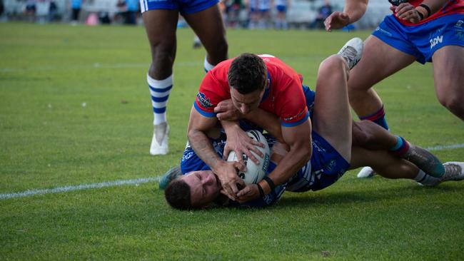 Devils Vs Butchers. Lachlan Hurst battles to score the try. Picture: Thomas Lisson