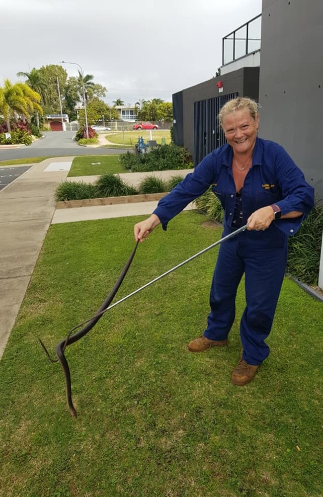 Heather Lampe, owner of Sarina Snake Removal, with a large eastern brown snake.