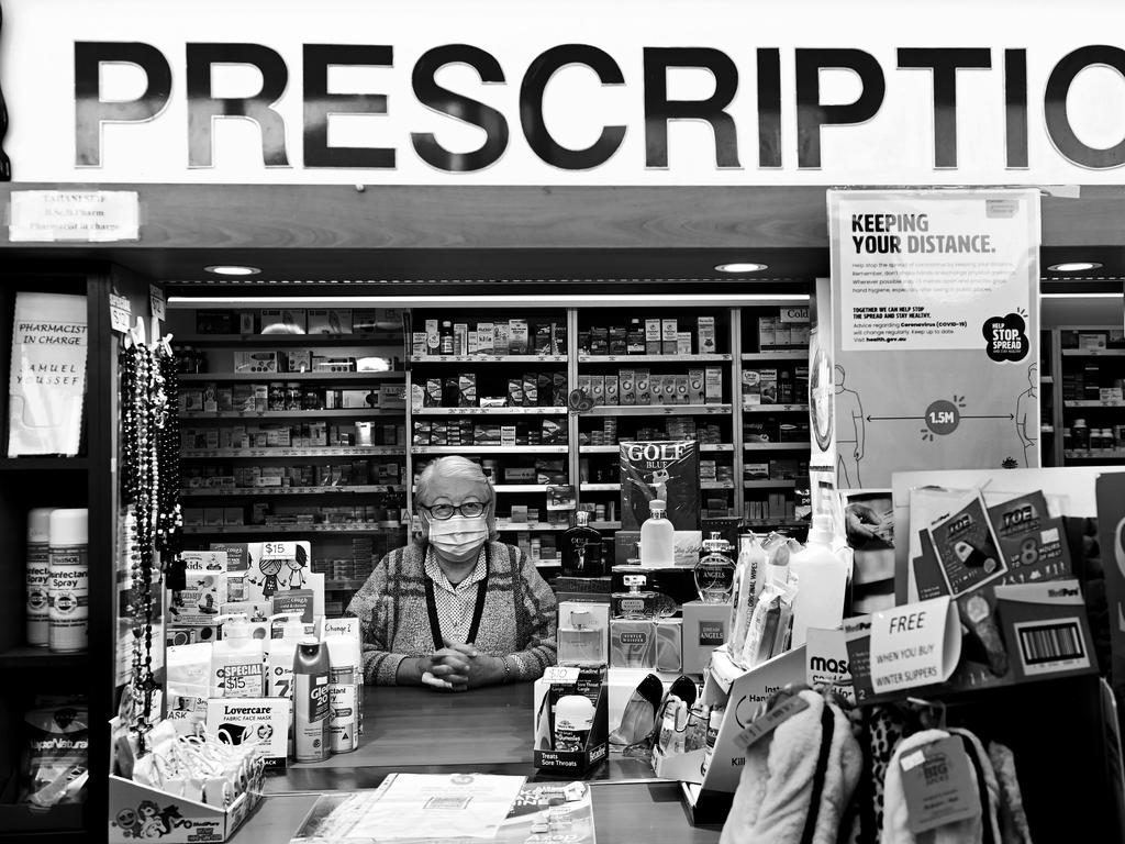 FACES OF LOCKDOWN: Mona Alkhoury, 66, of South Wentworthville working as a pharmacy assistant at St Anthony's Pharmacy in Guildford. Photo: Jeremy Piper