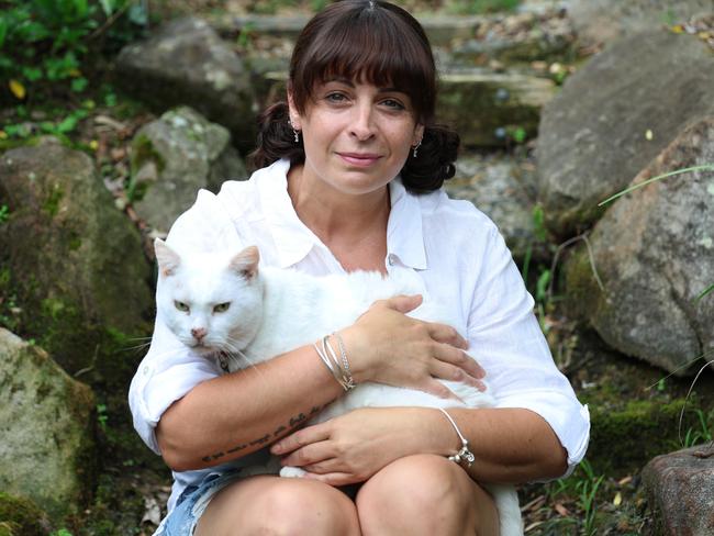 11/2/25: Aalia Ahmed and her cat Leo for a feature story about her experience of fighting breast cancer but then also how her treatment put her into menopause and she was given little warning or information before it happened. John Feder/The Australian.