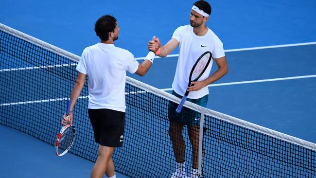 Grigor Dimitrov and Dominic Thiem come together after the match. Picture: AFP Photo