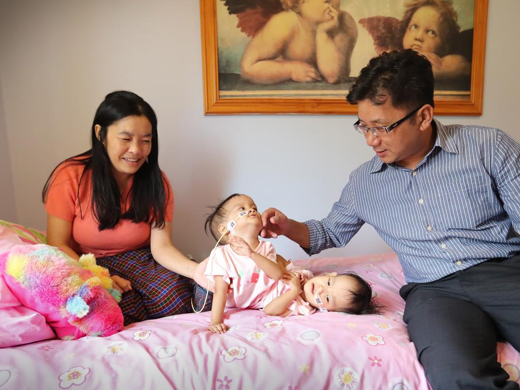 Mum Bhumchu and Nima and Dawa relax at the retreat with visiting Bhutanese paediatric surgeon Dr Karma Sherbub. Picture: Alex Coppel