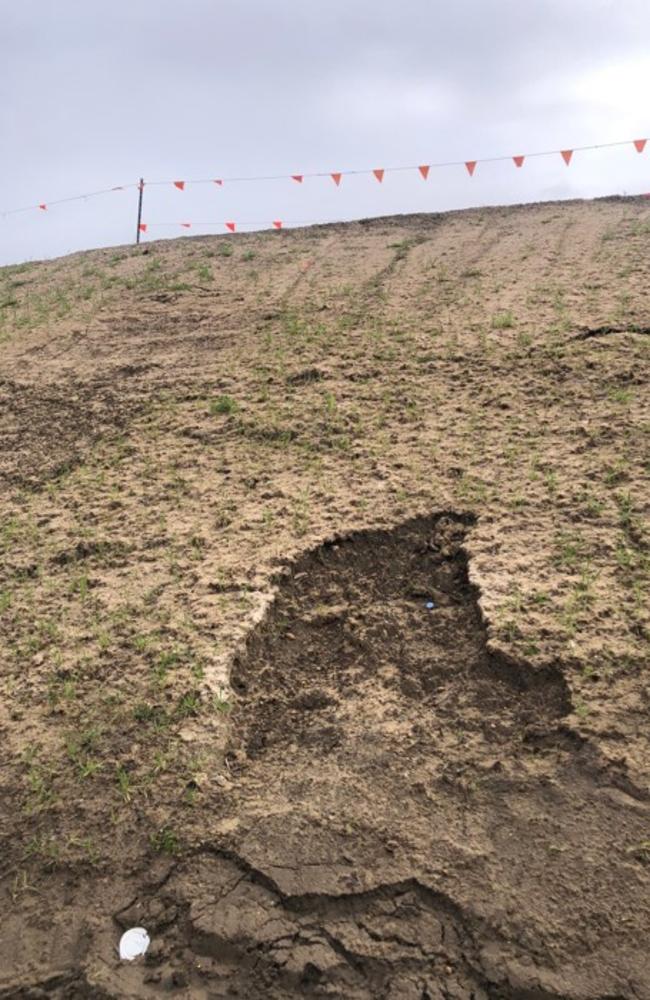 A section of the road embankment is eroding away. Picture: Jim O’Rourke