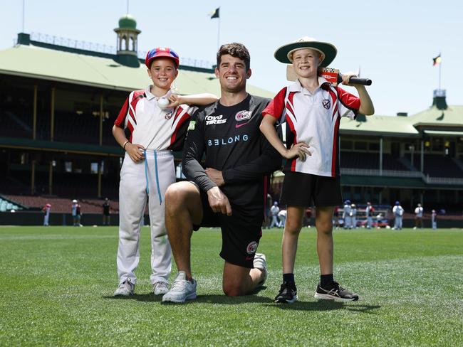 Sixers captain Moises Henriques with Emily Moore and Finn Gadsby from Leichhardt Wanderers Cricket Club. Picture: Richard Dobson