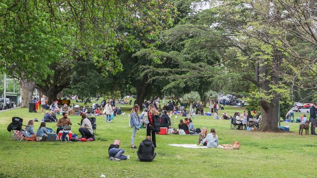 Crowds gather for picnics at the Royal Botanic Gardens in Melbourne.