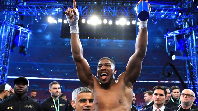 Anthony Joshua celebrates his victory over Wladimir Klitschko in the IBF, WBA and IBO heavyweight world title bout at Wembley Stadium on Sunday