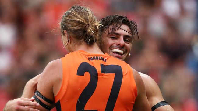 Giants Stephen Coniglio celebrates kicking a goal with Harry Himmelberg during AFL match between the GWS Giants and Essendon at Giants Stadium. Picture. Phil Hillyard