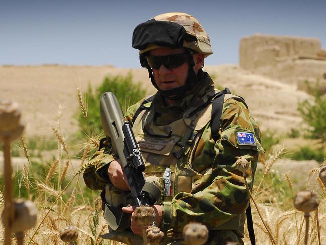 Photo By: Corporal (CPL) Ricky FullerCaption: Brigadier John Caligari, Deputy Commander of Australian Forces in Afghanistan, moves through a poppy field in Oruzgan Province. The Brigadier joined his soldiers from the 1st Mentoring and Reconstruction Task Force during a recent visit to their base in southern Afghanistan.Mid Caption: Deputy Commander joins his troops on the ground in southern Afghanistan.There is an old military adage that time spent in reconnaissance is time not wasted and during his recent visit to the 1st Mentoring and Reconstruction Task Force (MRTF ? 1), Deputy Commander of Australian Forces in Afghanistan, Brigadier John Caligari, took the opportunity to gain a first hand experience of the world in which his soldiers operate.Having joined the Battle Group on a mission ?outside the wire? to participate in the opening of the Australian built Sorkh Morgab Basic Health Centre, the Brigadier joined MRTF ? 1 Commanding Officer, Lieutenant Colonel Shane Gabriel and the soldiers from one of his Operational Mentoring and Liaison Teams on a foot patrol of the surrounding region.The area has seen serious engagements with the Taliban during the eight month deployment of the 1st Mentoring and Reconstruction Task Force.The Brigadier experienced first hand the complex urban and rural environments in which his soldiers have had to operate and the oppressive heat of the Afghan summer. Brigadier Caligari also got to meet the local people who are benefiting from both Australian lines of operation, the mentoring of Afghan soldiers and the reconstruction of much needed infrastructure in the rural province.