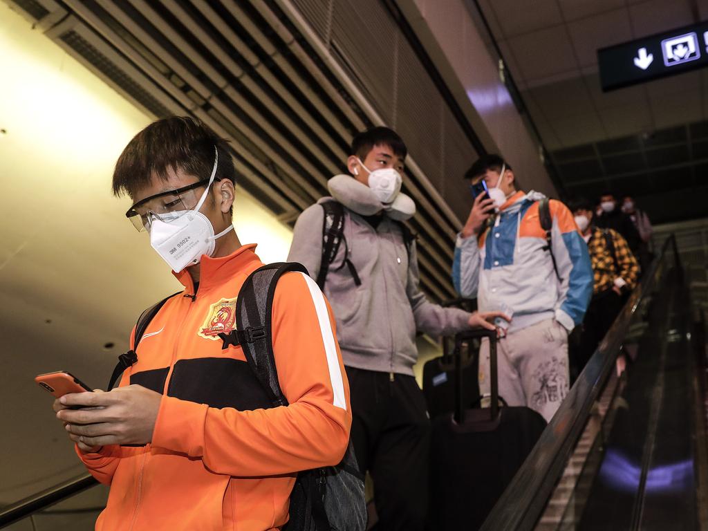 Players of the Wuhan Zall football team arrive at Wuhan railway station. Picture: Getty Images