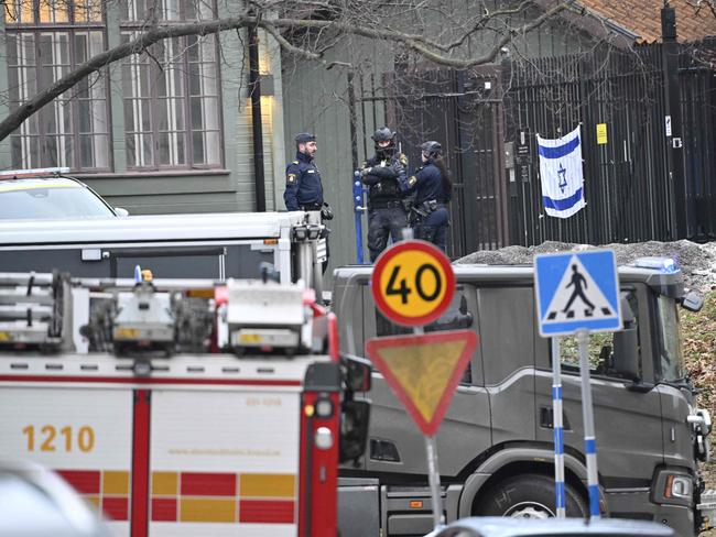 Police officers are seen outside the Israeli embassy in Stockholm where the bomb squad destroyed a “live” device. Picture: AFP