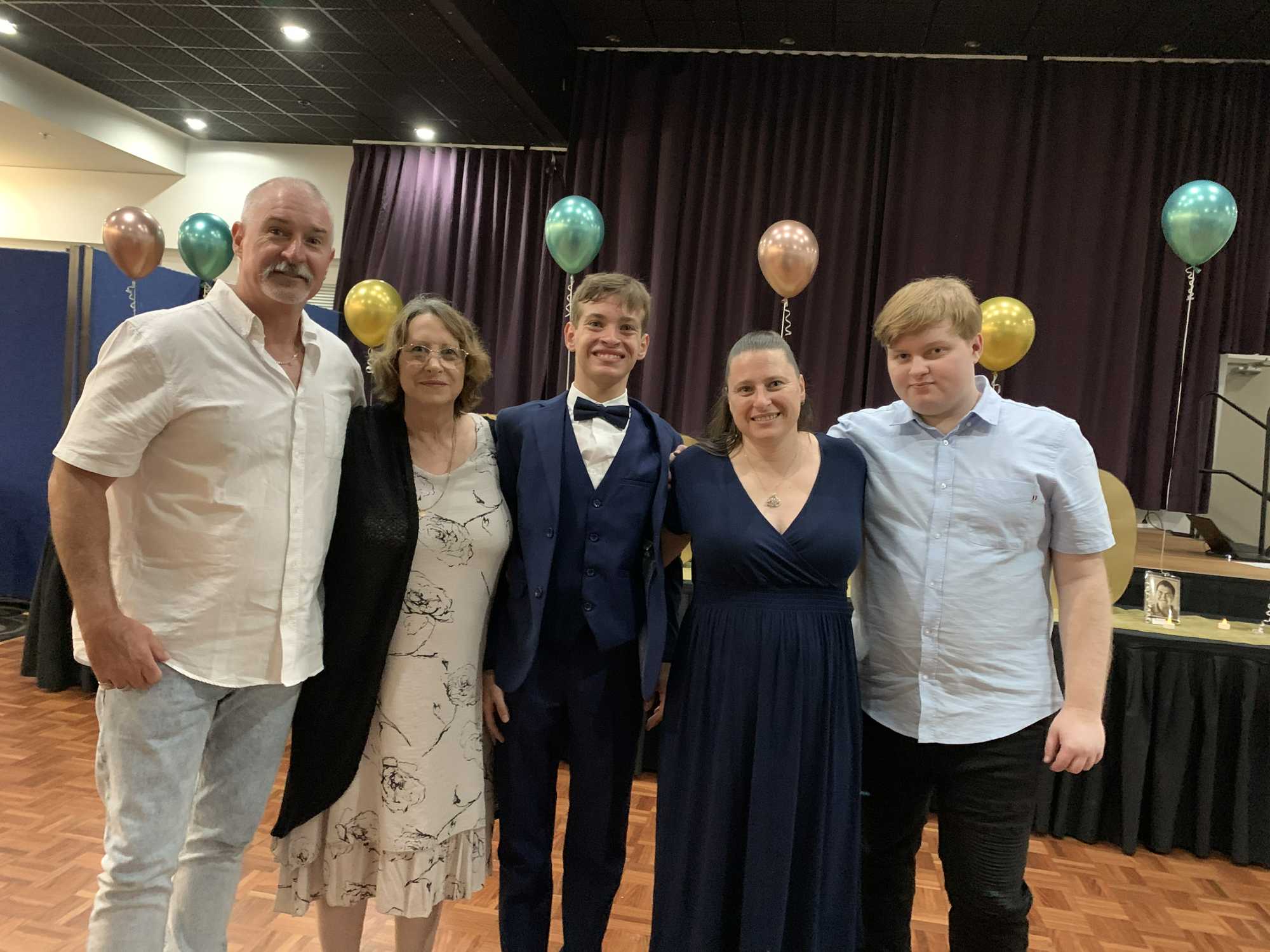 Graduating students from Hervey Bay Special School celebrate their formal.