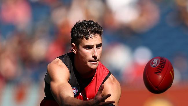 MELBOURNE, AUSTRALIA - MARCH 22: Elijah Tsatas of the Bombers in action during the round two AFL match between Essendon Bombers and Adelaide Crows at Melbourne Cricket Ground on March 22, 2025 in Melbourne, Australia. (Photo by Graham Denholm/Getty Images)