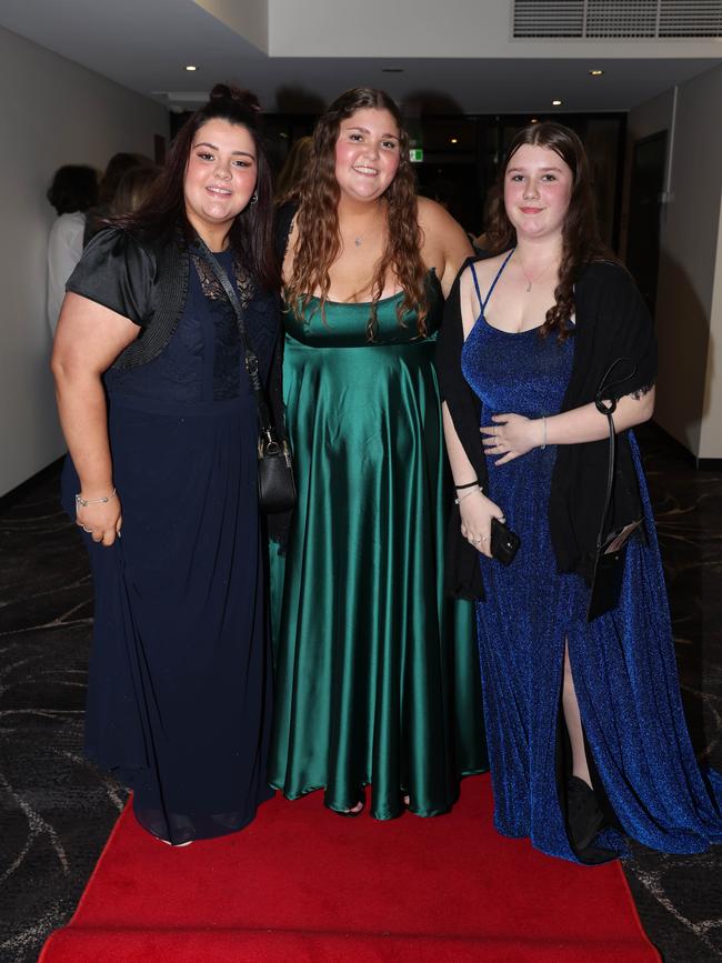 MELBOURNE, AUSTRALIA – JUNE 14 2024 Kiera Salmon, Shakiyah Walters and Nikiah Mcfadyen attend the Lowanna College Senior Formal 2024 at the Moe Racing Club Picture: Brendan Beckett