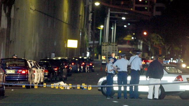 Police at the scene of the murder of Naser Ghaderi and Keyvan Ghajaloo.