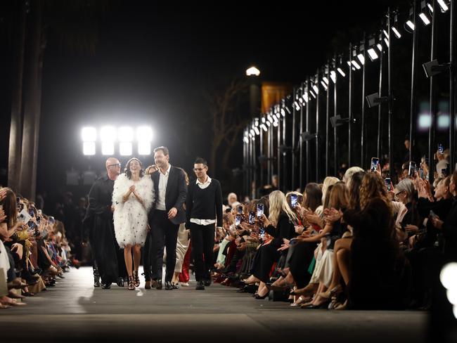 Model Charlee Fraser and CEO Alex Schuman during the finale of the Carla Zampatti 60th anniversary runway show, during Australian Fashion Week 2025 at the MCA Lawn in The Rocks. Picture: Jonathan Ng