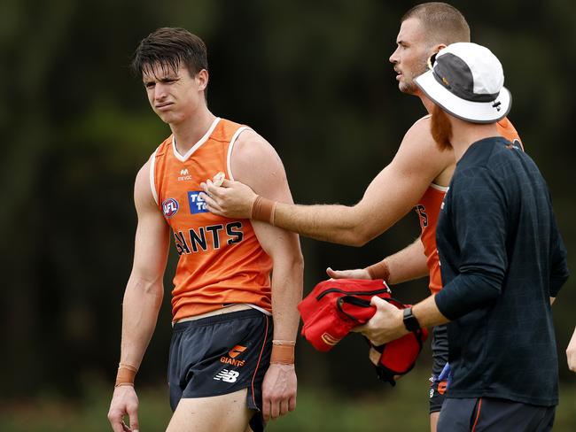 Taylor had to be assisted from the field after a heavy collision. Picture: Phil Hillyard