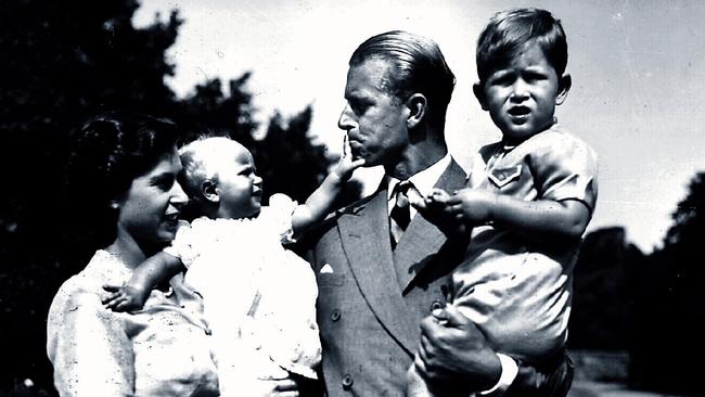 A young Queen Elizabeth with Prince Philip and their children, Princess Anne and Princes Charles.