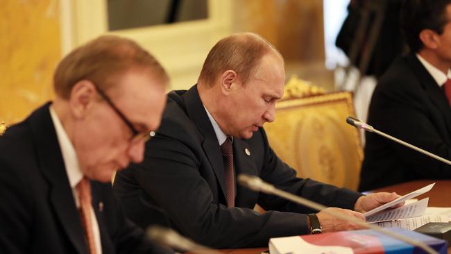 Bob Carr in his role as Minister of Australian Foreign Affairs with the President of the Russian Federation Vladimir Putin in 2013.Pic: ELLA PELLEGRINI