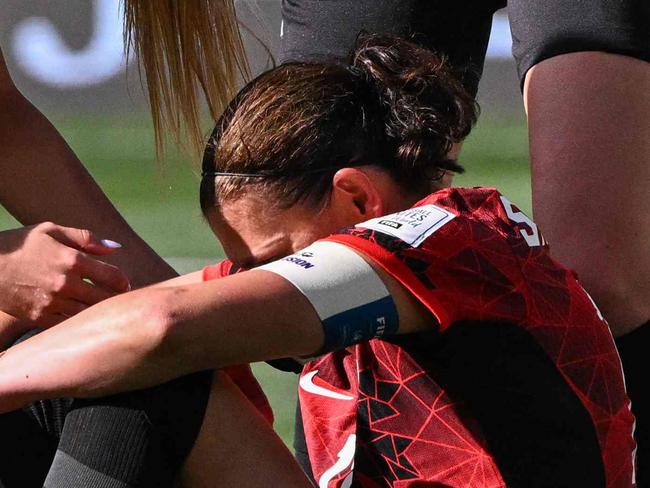 Canada's forward #12 Christine Sinclair reacts on the ground after missing a penalty during the Australia and New Zealand 2023 Women's World Cup Group B football match between Nigeria and Canada at Melbourne Rectangular Stadium, also known as AAMI Park, in Melbourne on July 21, 2023. (Photo by WILLIAM WEST / AFP)