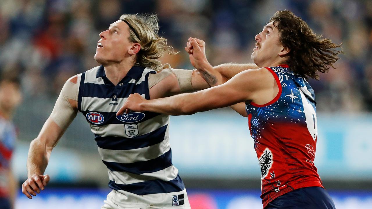 Mark Blicavs of the Cats and Luke Jackson of the Demons. Picture: Dylan Burns