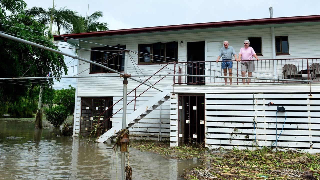 Townsville floods. Aftermath in Hermit Park. Neville and Gail Mosch survey their back yard, which overlooks Ross River, in the home they survived Cyclone Althea in 1971. Picture: Evan Morgan