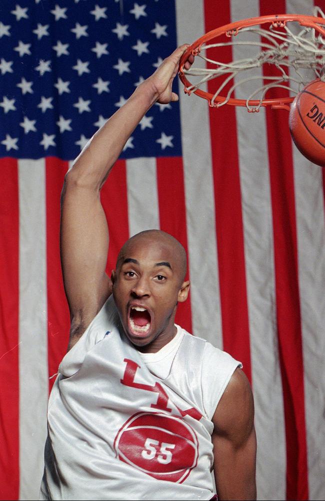 Kobe Bryant dunks the ball at his high school gym during a practice in 1996. Picture: AP