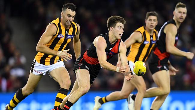 Zach Merrett dashes away from Jonathon Ceglar last season. Essendon and Hawthorn kicks off Footy Frenzy II. Picture: Getty Images