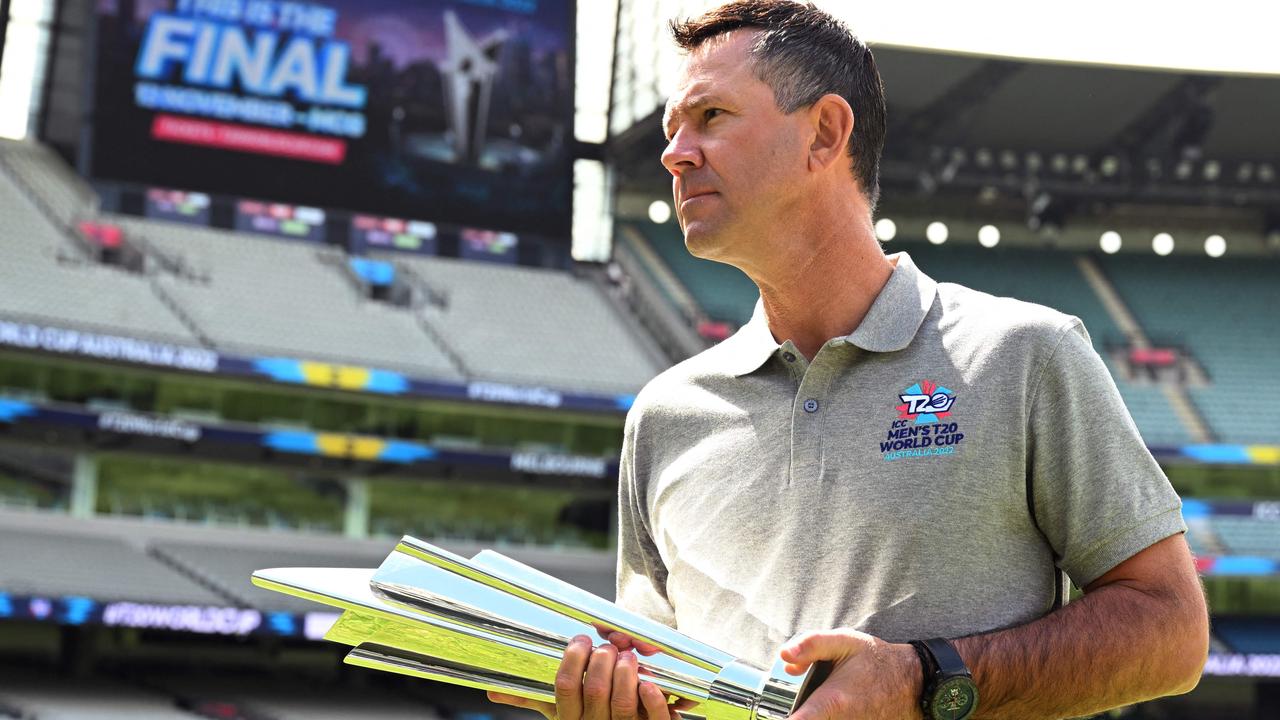 Former Australian cricket player Ricky Ponting holds the ICC men's Twenty20 World Cup trophy during a promotional event for the upcoming final at the MCG, in Melbourne on November 3, 2022. (Photo by William WEST / AFP)