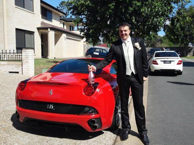 Daniel Milos with one of his luxury cars.