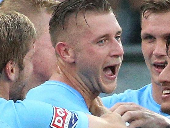 Marcin Budzinski of Melbourne City celebrates with team mates after scoring their first goal during the A-League Round 17 match between Melbourne City FC and Adelaide United at AAMI Park, Melbourne, on Sunday, January 21, 2018. (AAP Image/Hamish Blair) NO ARCHIVING, EDITORIAL USE ONLY