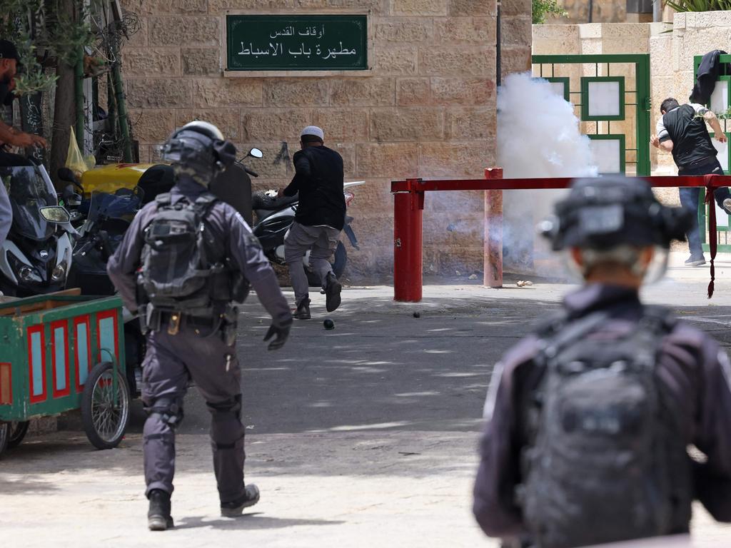 Palestinians threw rocks at Israeli officers in riot gear who fired rubber bullets, stun grenades and tear gas on the esplanade of the revered Al-Aqsa mosque. Picture: Emmanuel Dunand / AFP