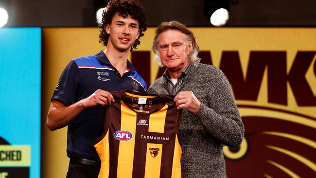 Central District’s Will McCabe (left) is presented with his Hawthorn jumper by Hawks legend Michael Tuck after being selected at pick 19 at the AFL national draft. Picture: Michael Willson/AFL Photos via Getty Images