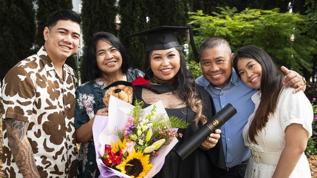 Bachelor of Information Technology graduation Kristine Silang with (from left) Coddy Ramchand, Marsha Silang, Wilmer Silang and Keycee Santias at a UniSQ graduation ceremony at The Empire, Wednesday, October 30, 2024. Picture: Kevin Farmer