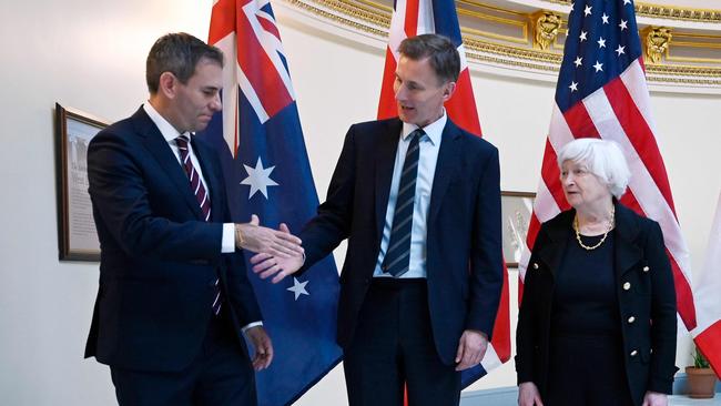 Treasurer Jim Chalmers shakes hands with Britain's Chancellor of the Exchequer, Jeremy Hunt, as US Treasury Secretary Janet Yellen looks on. Picture: AFP