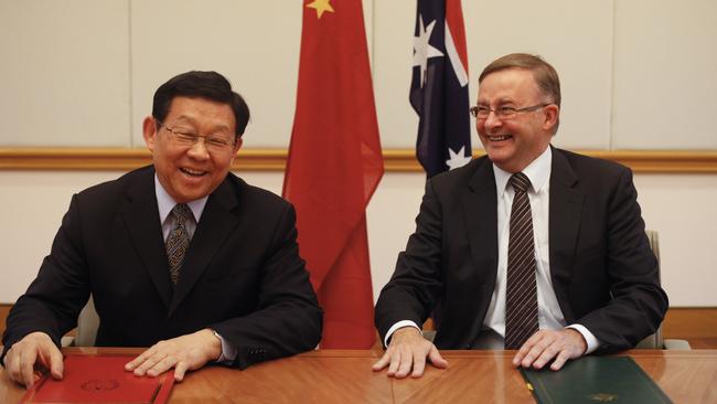 Anthony Albanese (right) and then Chinese Commerce Minister Chen Deming sign a Memorandum of Understanding at Parliament House in Canberra in 2012.