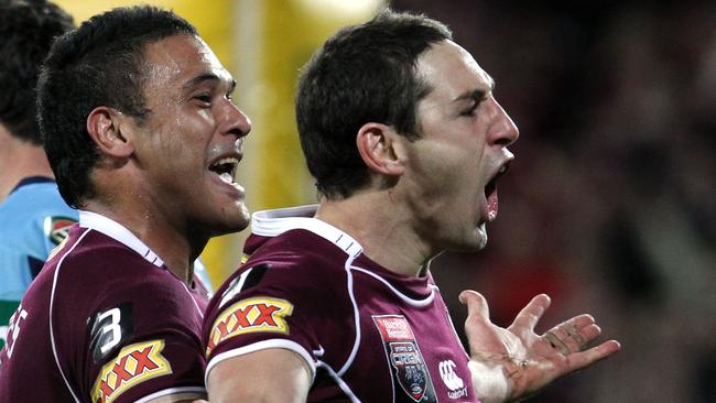 Justin Hodges and Billy Slater celebrate a Queensland Maroons try.