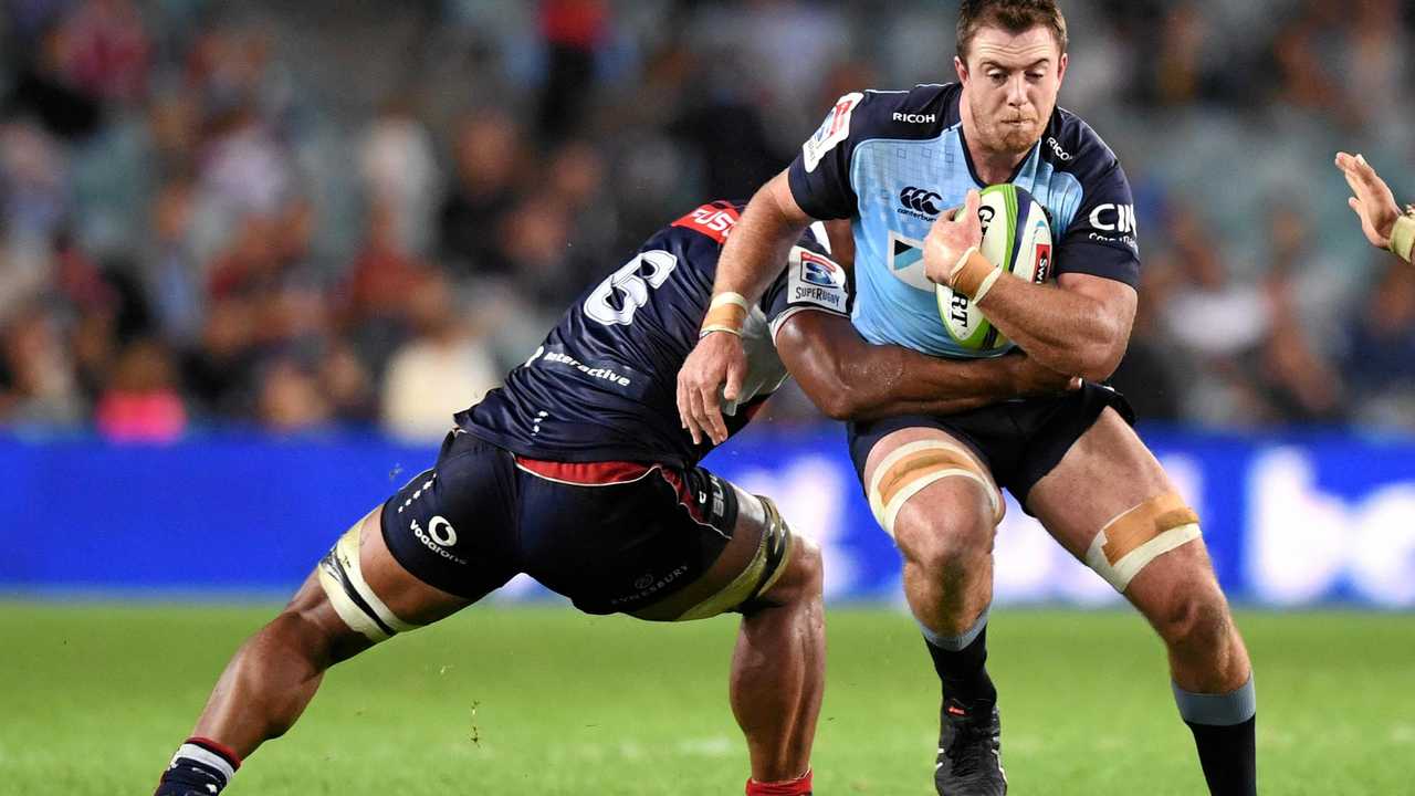 Jed Holloway (right) of the Waratahs is tackled by Lopeti Timani of the Rebels  . Picture: PAUL MILLER/AAP PHOTOS