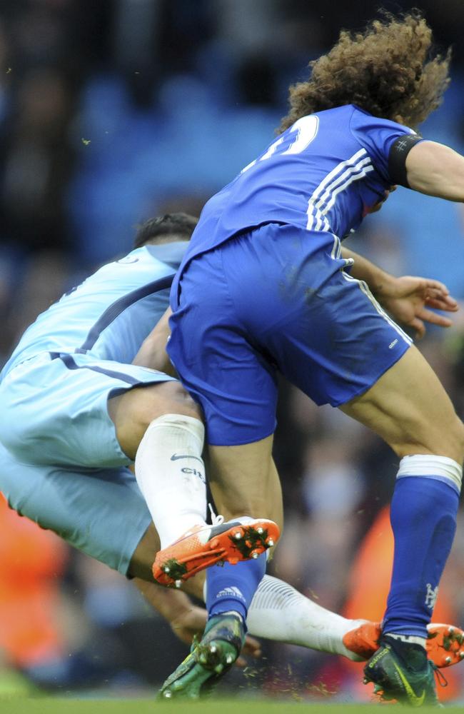 Manchester City's Sergio Aguero (L) is red carded for this tackle on Chelsea's David Luiz.