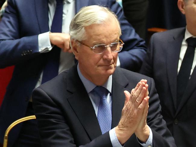 French Prime Minister Michel Barnier gestures after the result of the no-confidence vote on his administration at the National Assembly in Paris on December 4, 2024 as French MPs voted to oust his government after just three months in office in a move which deepens a political crisis in the country. The French National Assembly was voting two motions brought by the French left-wing Nouveau Front Populaire (New Popular Front) NFP coalition and the French far-right Rassemblement National (National Rally) RN party in a standoff over 2025's austerity budget, which saw French Prime Minister force through a social security financing bill without a vote (article 49.3) on December 2, 2024. (Photo by ALAIN JOCARD / AFP)