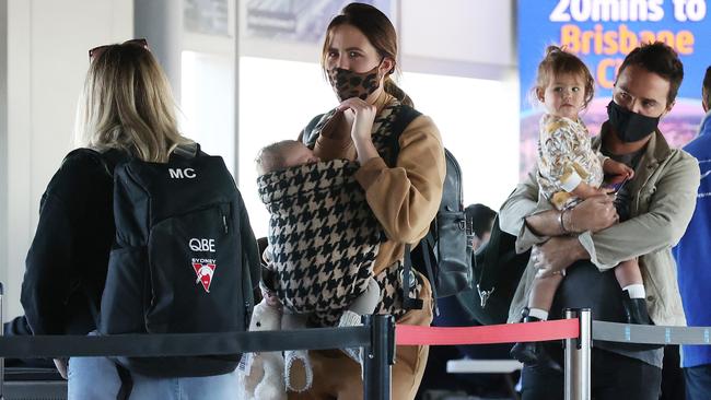 Jesinta Franklin and son Rocky arrive at Brisbane airport. Picture: Liam Kidston