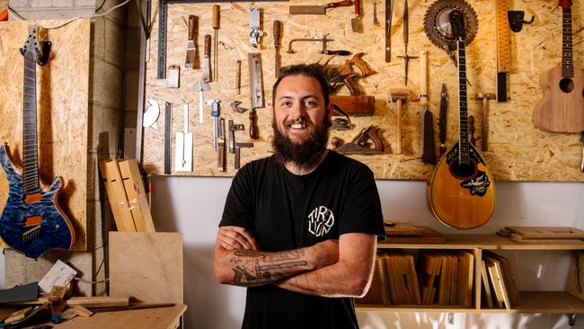 Jordan Reynolds, who makes custom guitars with his business The Sound Garage, now at a new premises at The Mill on Angas St in the city in Adelaide, Tuesday, December 29, 2020. (The Advertiser/ Morgan Sette)