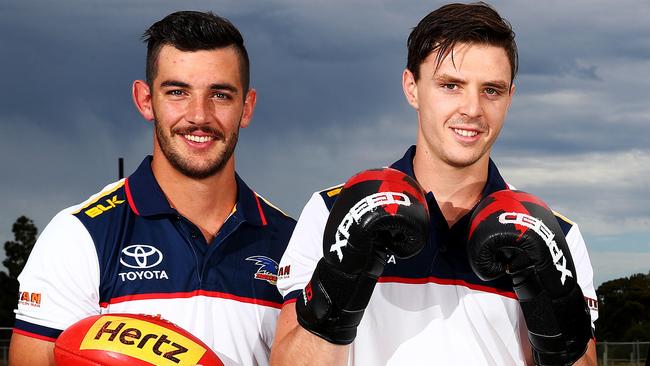 Taylor Walker and departing young star Jake Lever. Picture: Simon Cross