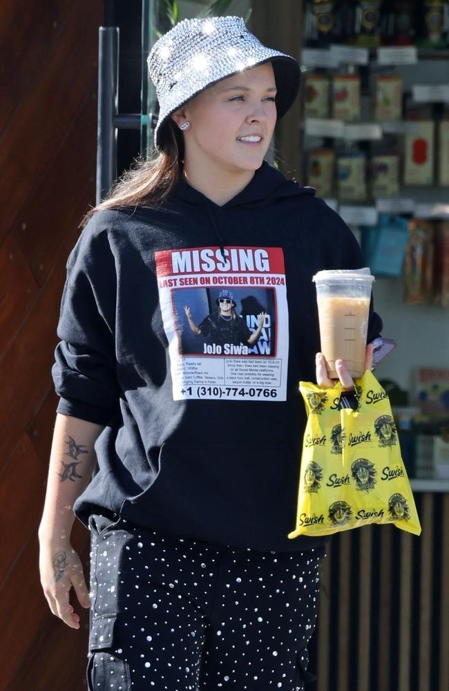 Never one to shy away from some self promotion, JoJo Siwa sports a hoodie with her own missing poster. Picture: Backgrid