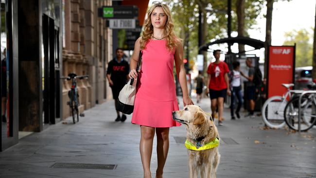 Rachael Leahcar with her RSB Guide Dog Ella at the location where she was refused an uber pick-up, on King William St in the city. Picture: Tricia Watkinson