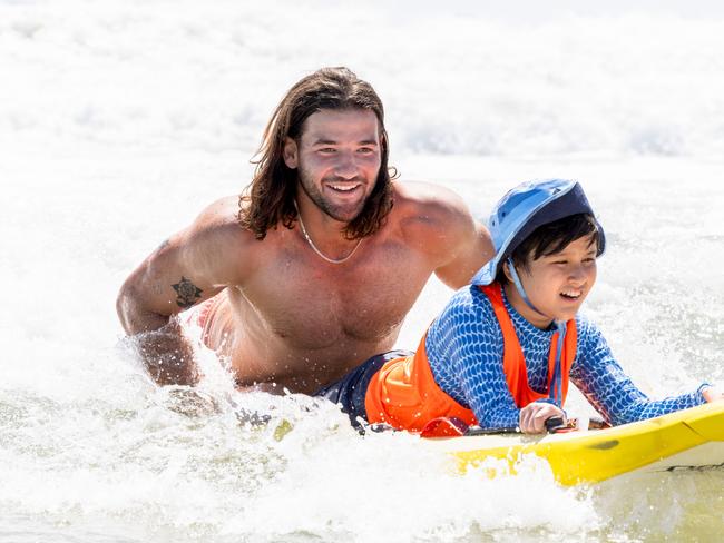 Pat Carrigan is a Gold Coast local, pictured here with a local nipper. Picture: Luke Marsden