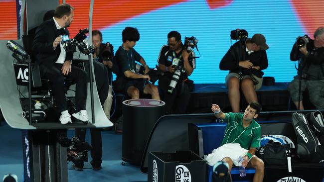 A furious Novak Djokovic argues with chair umpire Damien Dumusois. Picture: Getty Images