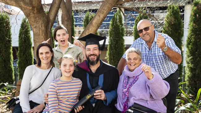 Bachelor of Engineering Science graduate Tim Parfitt with family (from left) Lisa, Abby and Conor Parfitt and Chris and Geoff Davidson at a UniSQ graduation ceremony at Empire Theatres, Wednesday, June 28, 2023. Picture: Kevin Farmer